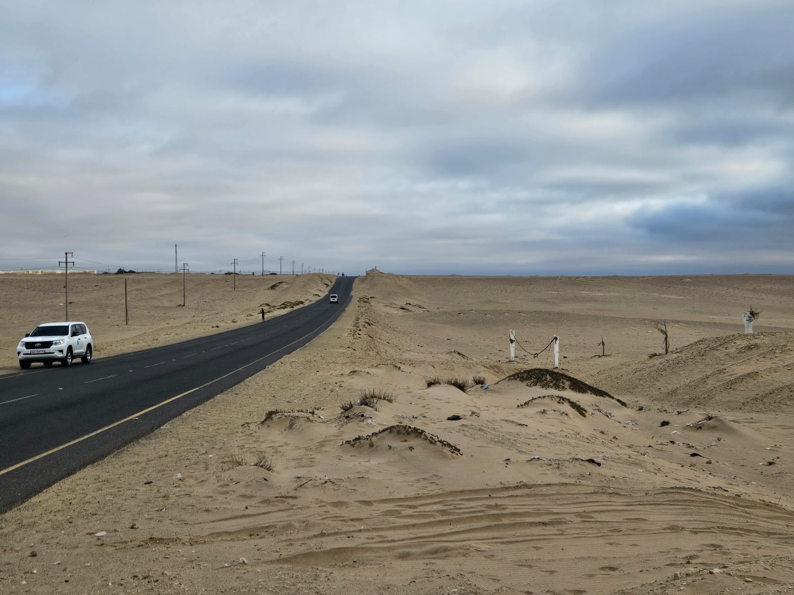 Road crossing the desert in Namibe Province, Angola