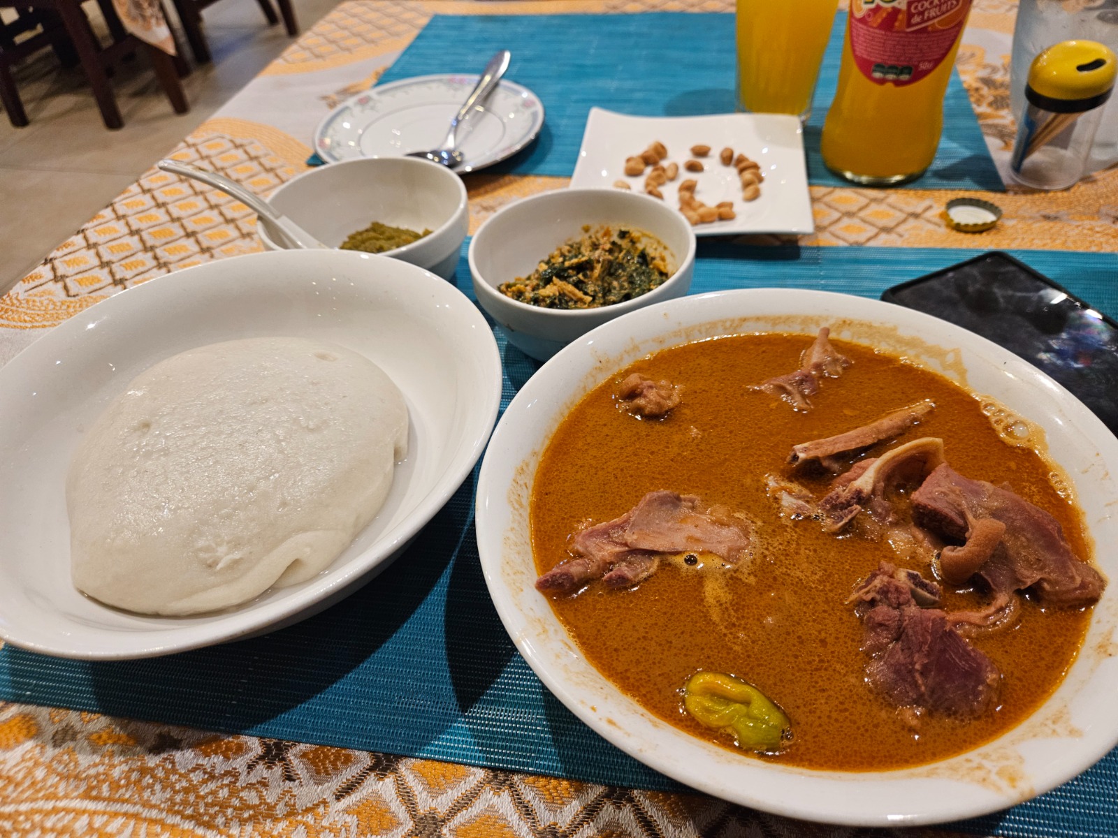 Fufu with mutton peanut sauce and gboma in Lomé