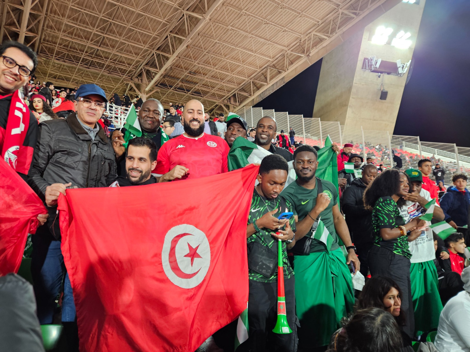 Tunisian and Nigerian supporters together at an AFCON match in Fes, Morocco
