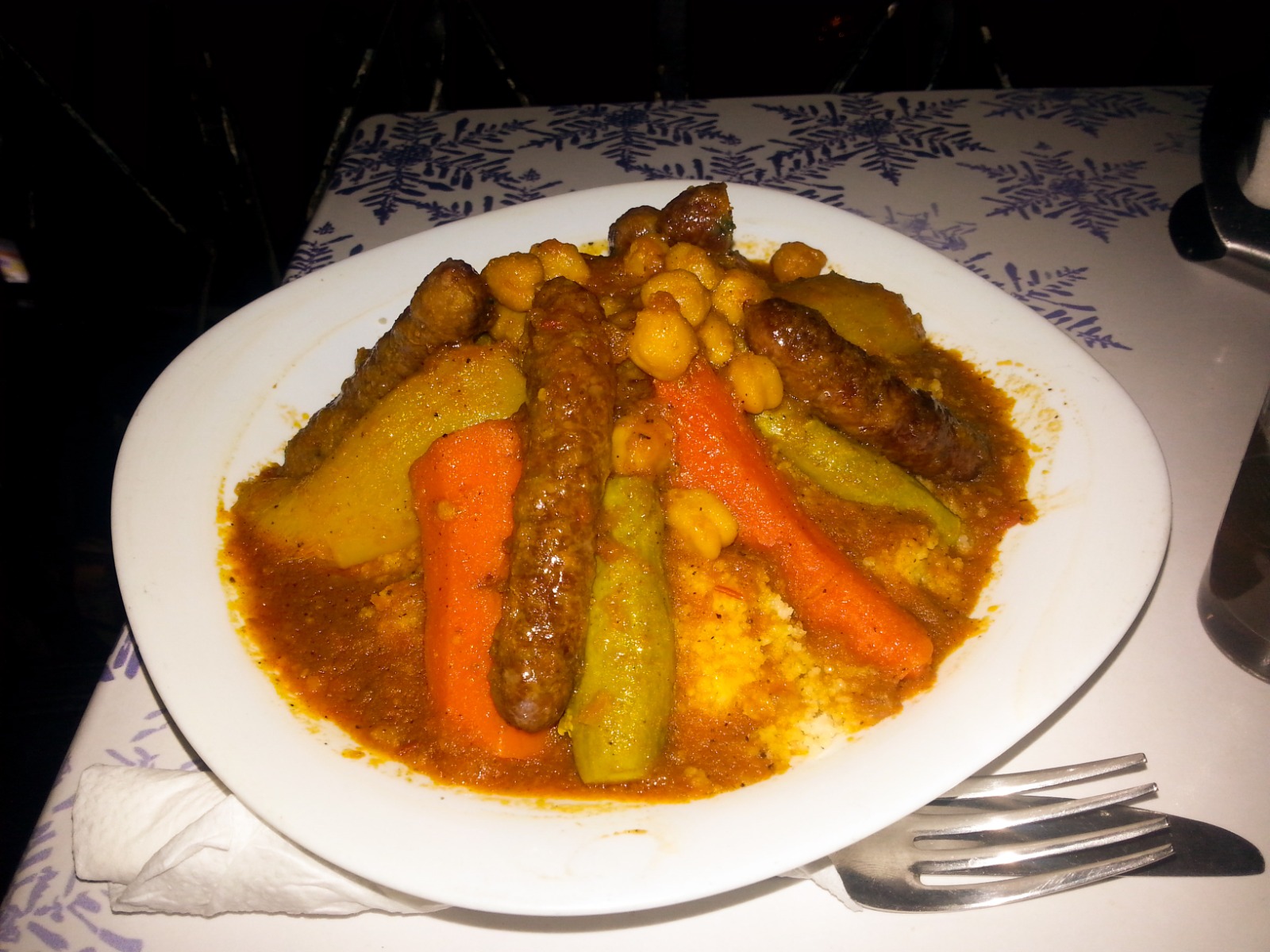 Traditional Moroccan couscous with vegetables and sausages